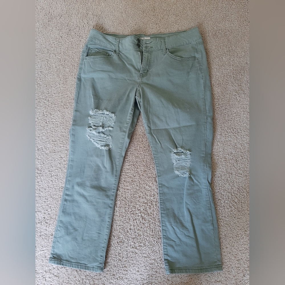 Denim Green ankle crop pants. Rips on the knees.